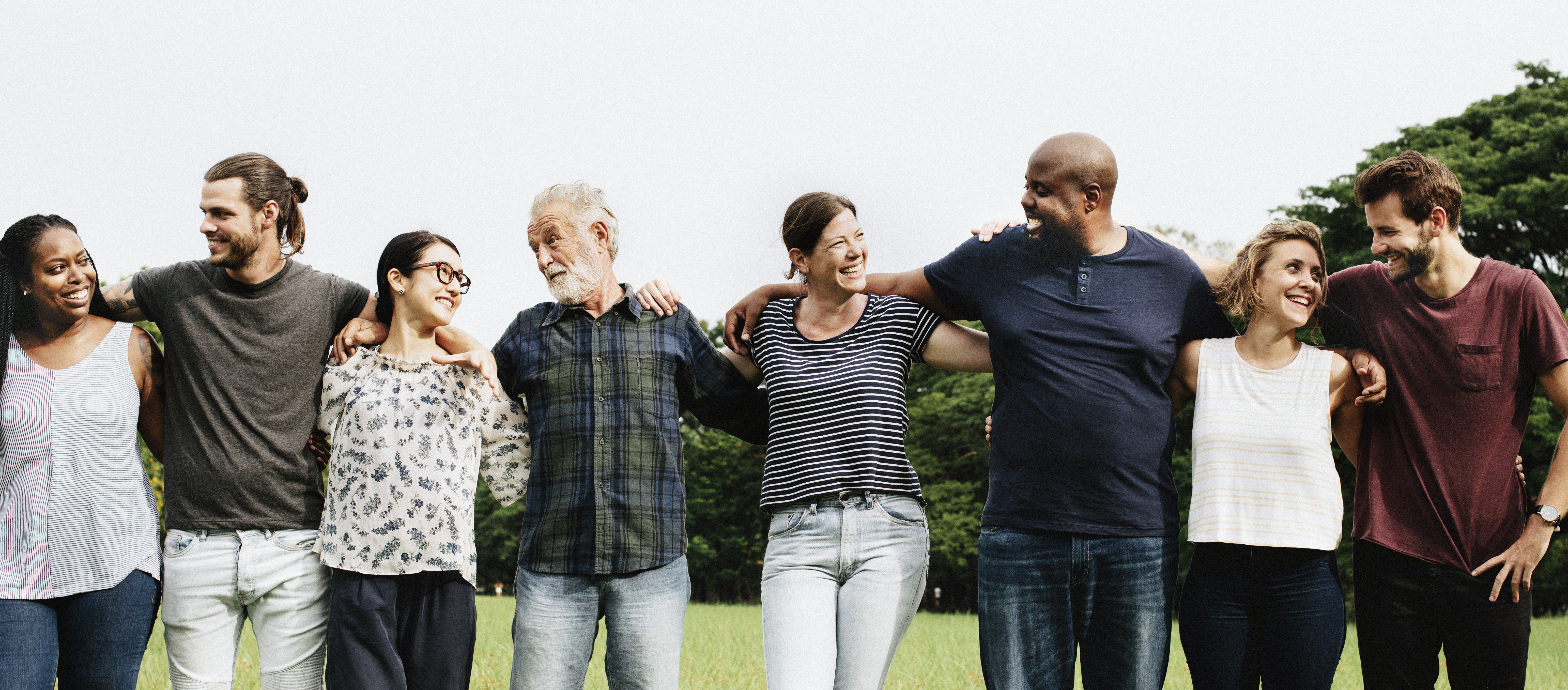 Group of people hugging each other in the park